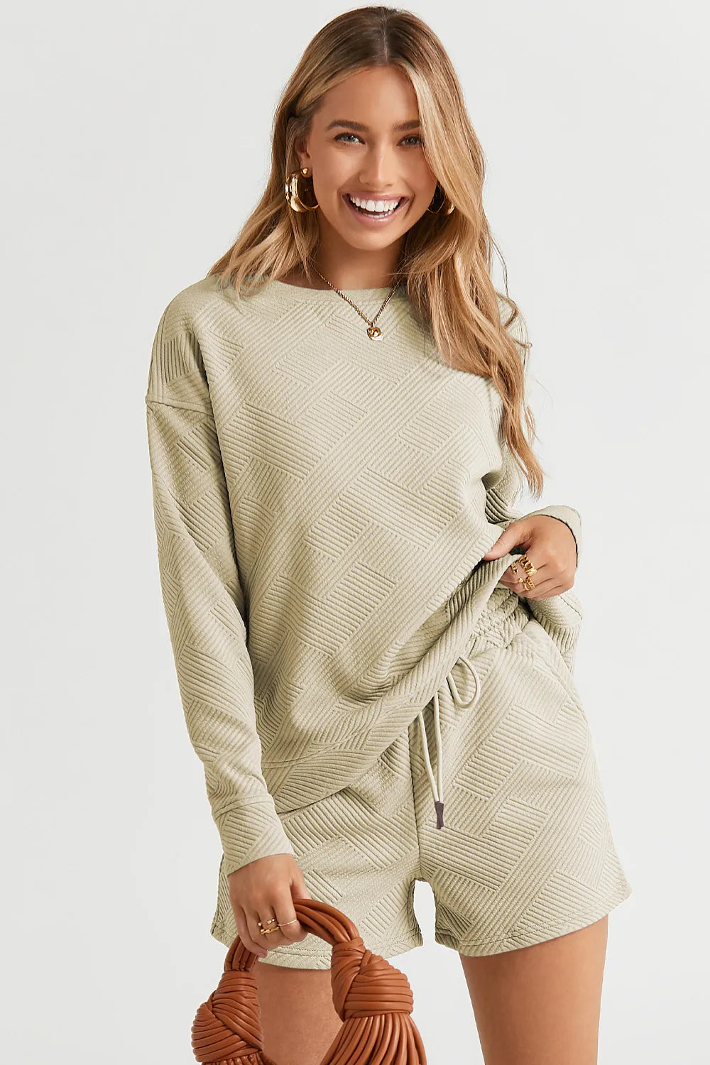 c5189ea5a4024a5bab8f4fe2379bb57d-Max.jpg Double Take Full Size Texture Long Sleeve Top and Drawstring Shorts Set - Image 29